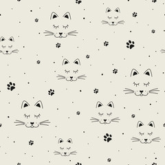 Cat faces and paws in black. Cat muzzle in cartoon style. Vector seamless pattern.