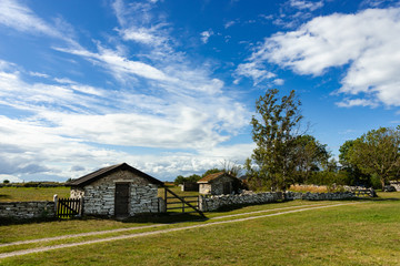 Old fishermen's houses, made of limestone slabs, on the east coast of the Swedish island of &Ouml;land in summer