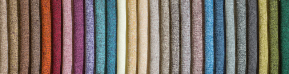 Various samples multicolored natural fabric background. Wide selection textiles. Long banner