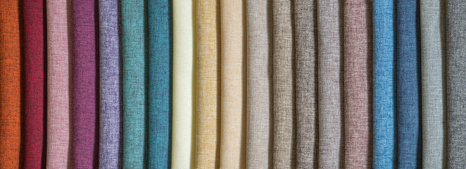 Various samples multicolored natural fabric background. Wide selection textiles. Long banner