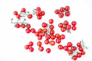 Red ripe cherry tomatoes on a white background.