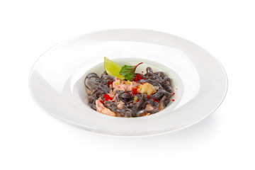 Black pasta with salmon isolated on white