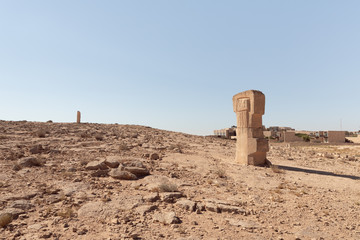 Large abstract figure carved from stone in a public sculpture park in the desert, on a cliff above the Judean Desert near Mitzpe Ramon, Israel.