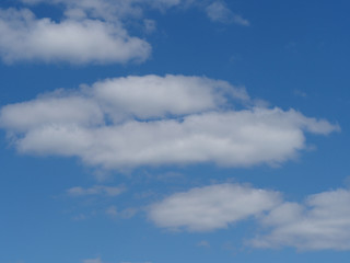 s white fluffy clouds in blue sky