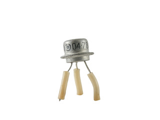 Old soviet transistor in metal case isolated on white background
