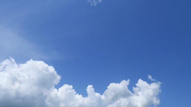 Motion TimeLapse of sunny clear blue sky with beautiful white cumulus clouds & puffy fluffy cloudscape on bright daylight horizon in tropical summer sunlight & sun ray at sunny sunshine day, B-roll 