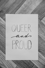 queer and proud written in watercolor