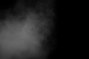 White smoke isolated on black background. Abstract background, design element.