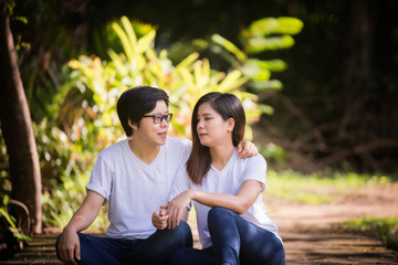 Fototapeta premium Young women are having fun on the green field in the morning.