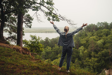 Young woman with child traveler conquered a high mountain. Summer Landscape