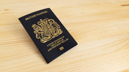 London, UNITED KINGDOM - AUGUST 17, 2020: New UK Passport Edition released in March 2020 after Brexit laid on desk, citizenship newsworthy