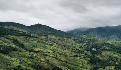 Village scenery on a misty green mountain in northern Thailand, Nan Province.