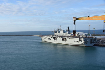 Aircraft or aeroplane carrier moored alongside berth in Fortaleza, Brasil. Ship looks like hanging...
