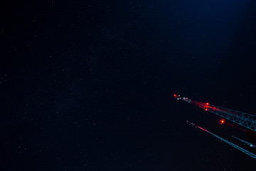 Naklejka premium Telecommunication Antenna with a Dark Blue Sky full of Stars.