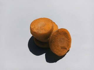 Carrot slices on white paper.