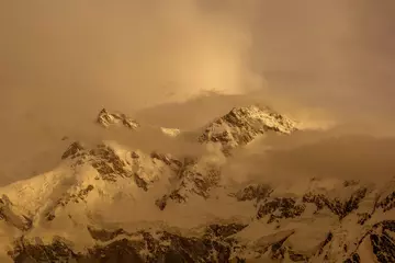 Foto auf Acrylglas Nanga Parbat nanga parbat mountain in golden light with clouds 
