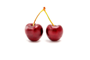 two cherries on a white background
