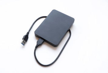 External hard drive top view. Data transfer to external hard drive on white isolated background,...