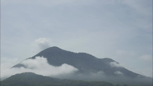 Time lapse Fog on the mountain moving fast.