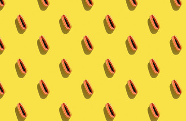 Trendy sunlight Summer pattern made with papaya on bright light yellow background