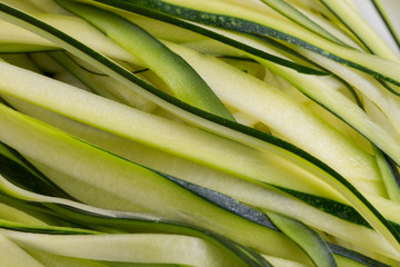 Fototapeta premium green sliced zucchini, courgette closeup selective focus