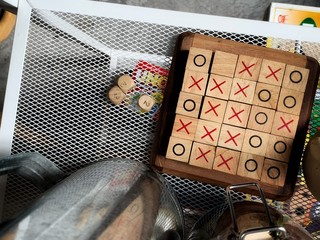 tic tac toe XO game , Wood Toys, warm light and vintage effect with interior decoration