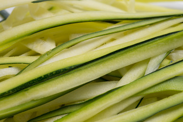 Obraz premium green sliced zucchini, courgette closeup selective focus
