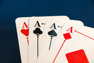 Four aces and chips, card game, cards on the table. Poker and blackjack.