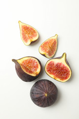 Fresh fig fruits and slices on white background, top view