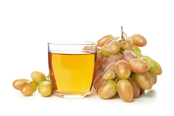 Ripe grape and glass of juice isolated on white background