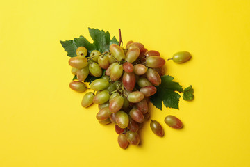 Fresh ripe grape on yellow background, top view