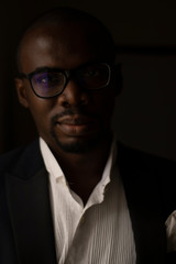 Obraz premium A handsome Black African Man with Glasses poses for a Portrait