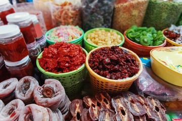Counter with exotic Asian dried fruits and preserves