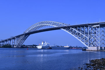 Fototapeta na wymiar Bayonne Bridge with ship going under it