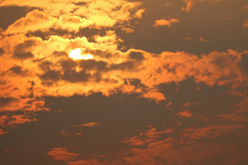 beautiful sunset orange yellow silhouette dark sky in back on cloud