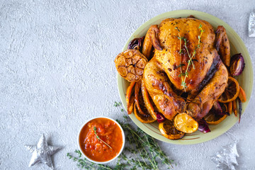 The Christmas table. Christmas dinner with chicken. Baked chicken. Top view