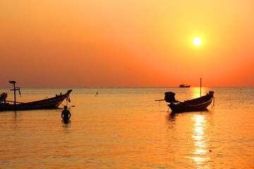 tourist are enjoy swimming on sea in evening time before sun set.silhouette  people in relax time with seascape,cloud sky nature  background.