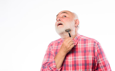 mature bearded man isolated on white. cut and brush hair. barbershop concept. shaving accessories. unshaven old man has moustache and beard. shaving razor blade tool kit. copy space