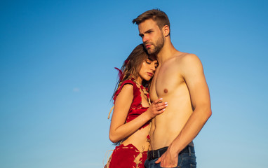 Being in love. hot summer weather. macho man has muscular body. sensual couple in love. sexy girl...