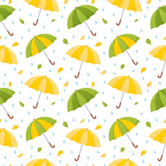 Fototapeta na wymiar Seamless pattern with multicolored umbrellas, raindrops and falling leaves.