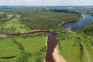 Fototapeta premium Forest lake from a height in the taiga
