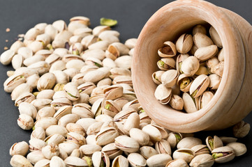 Pistachio on black background, in bowl