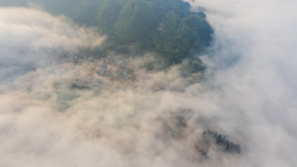 Aerial view of panorama landscape at the hill town in Sapa city, Vietnam with the sunny light and sunset, mountain view in the clouds