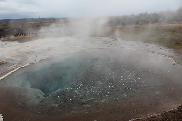 Steam rising from natural hot spring, Iceland