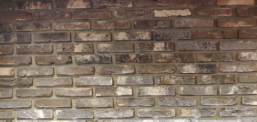 Brown-colored spotted block wall_background