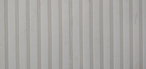 White walls_backgrounds with long vertical lines with embossing