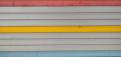 Shutter door_background of garage with red yellow blue line