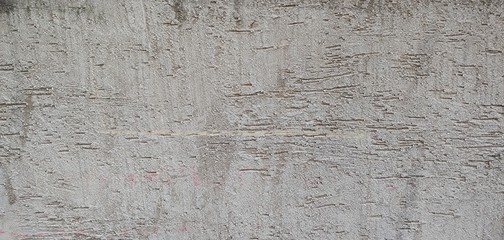 Rough gray wall with roller marks_background