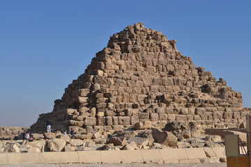 Fototapeta na wymiar The golden sandstone of the Great Pyramid of Giza, Egypt, and the blue sky