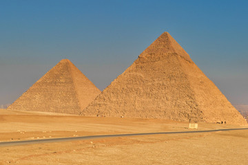 Fototapeta na wymiar The Great pyramids of Egypt in Giza, Cairo, on sunset